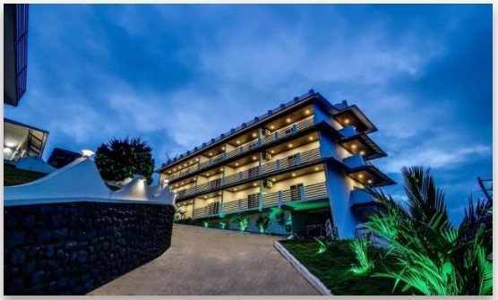 Misty Garden Resort building at dusk